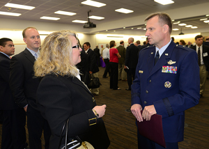 Photos of attendees networking at DISA's 2013 Forecast to Industry